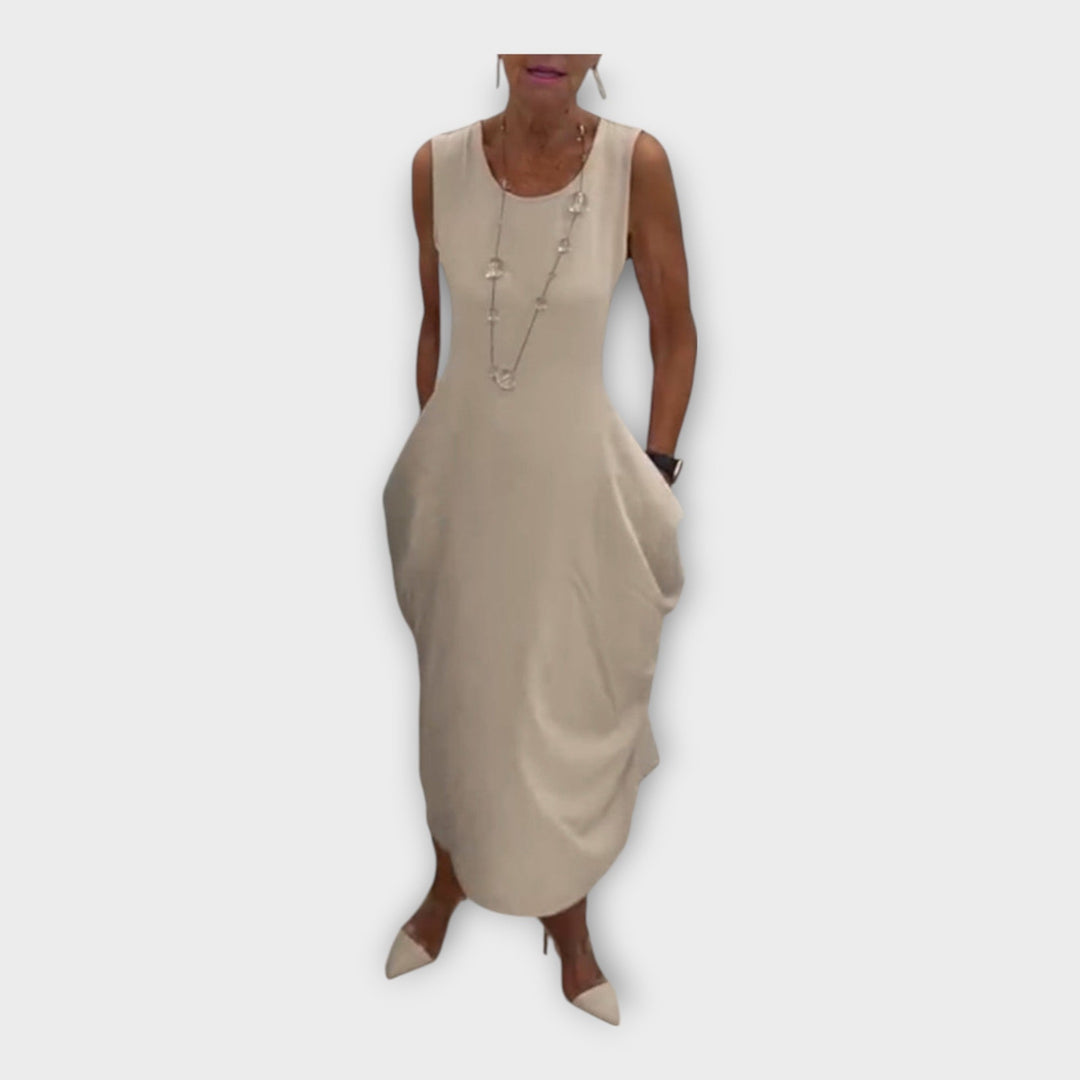 Lengva suknelė su šiuolaikiniu siluetu ir kišenėmis