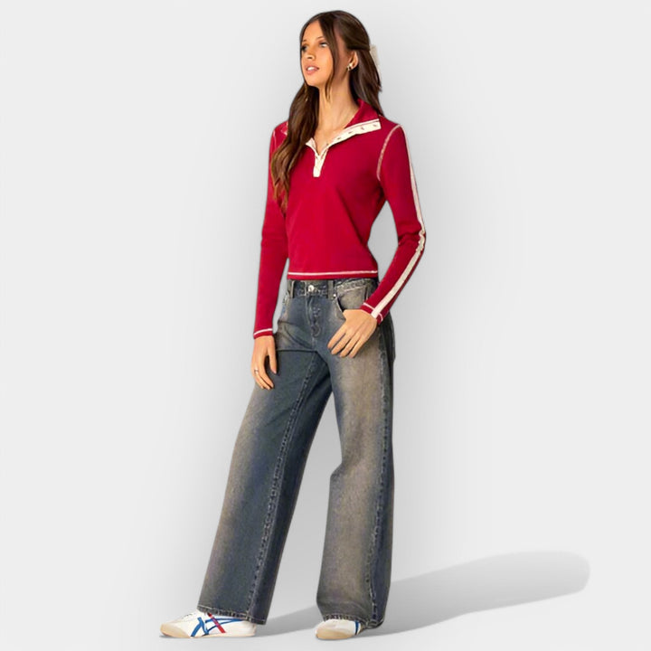 Džinsai su žemu liemeniu.